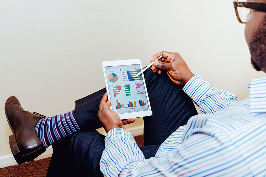 Man Working on Tablet with Stylus Man Working on Tablet with Stylus